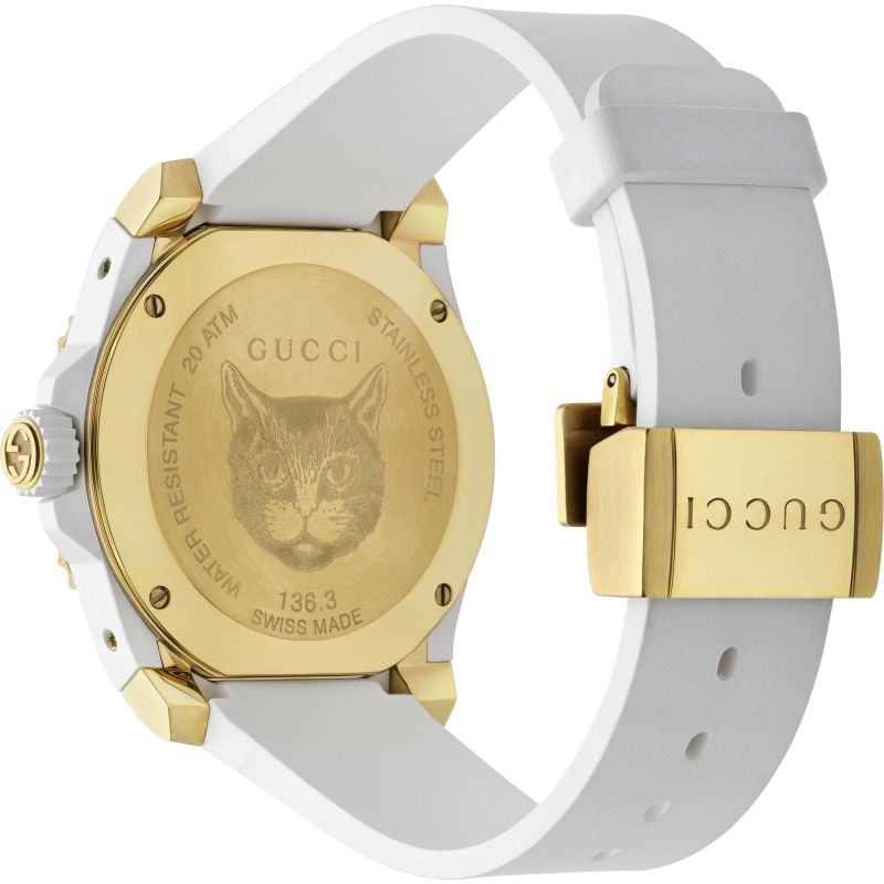 Brand: Gucci Series: Dive Model: YA136322 Gender: Men's Movement: Quartz Water Resistance: 200 meters / 660 feet Features: Analog, Ceramic, Gold, Rubber, Stainless Steel
