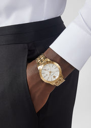 Brand: Versace Series: Univers Model: VEBK00518 Gender: Men's Movement: Quartz Water Resistance: 30 meters / 100 feet Features: Analog, GMT, Gold, Stainless Steel, Time Zone